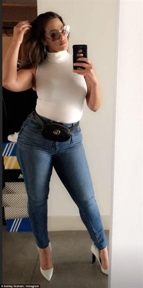 Ashley Graham poses completely nude in a racy mirror selfie.